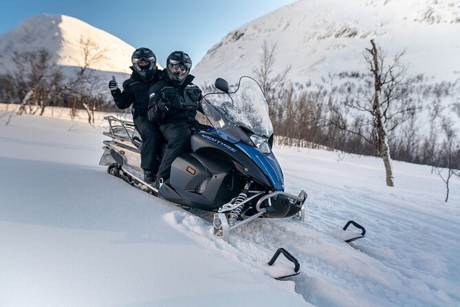 Adventure Snowmobile Safari - Riding two to a snowmobile through Tamokdalen