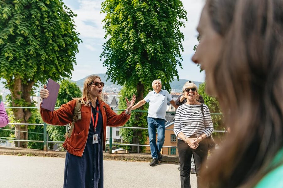 Bergen: Past & Present Small Group Guided Walking Tour - Reading Bergen’s trade story at Bryggen