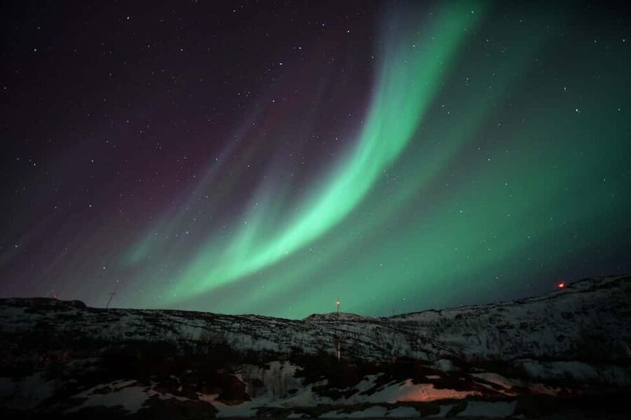 From Tromsø: Aurora Bus Tour with Snacks, Photos, and Drinks - Setting out from Tromsø after dark