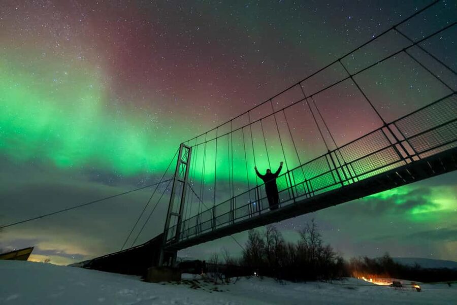 From Tromsø: Aurora Minibus Chase with Portrait and Hot Meal - Hunting clear skies near lakes, beaches, and the border