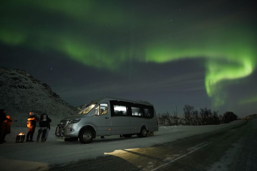 Tromsø: Northern Lights Tour with Free Professional Portrait - Leaving Kirkegata 2 after dark
