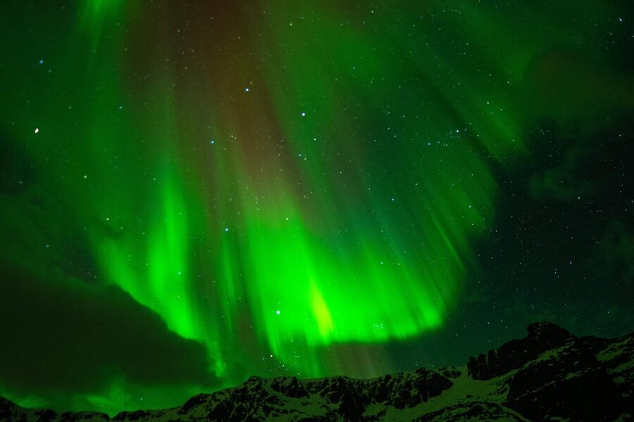Tromsø: Small-Group Adventurous Northern Lights Hunt - Leaving Tromsø in a black Mercedes minibus